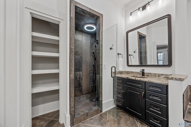 2603 Whitesburg Dr, Huntsville, AL 35801 - full bathroom featuring vanity, a spacious closet, a shower stall, and crown molding