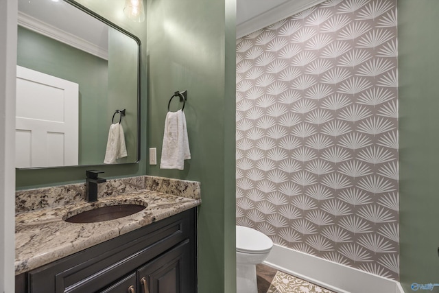 2603 Whitesburg Dr, Huntsville, AL 35801 - half bathroom featuring vanity, ornamental molding, and toilet