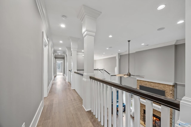 2603 Whitesburg Dr, Huntsville, AL 35801 - hall with crown molding, recessed lighting, light wood-style floors, baseboards, and decorative columns