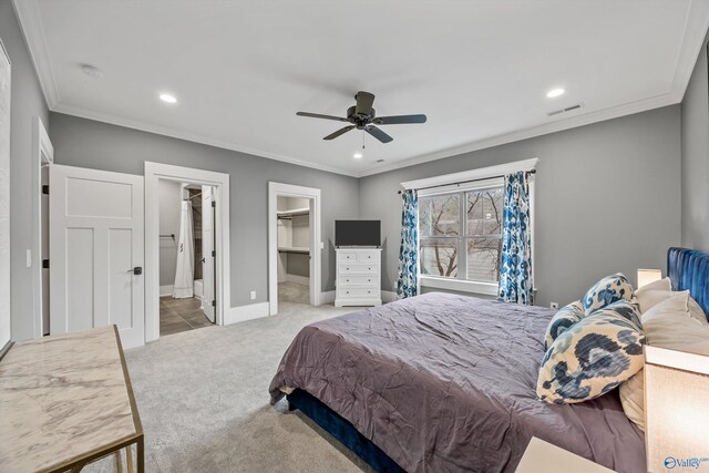 2603 Whitesburg Dr, Huntsville, AL 35801 - carpeted bedroom with a spacious closet, ornamental molding, visible vents, and recessed lighting