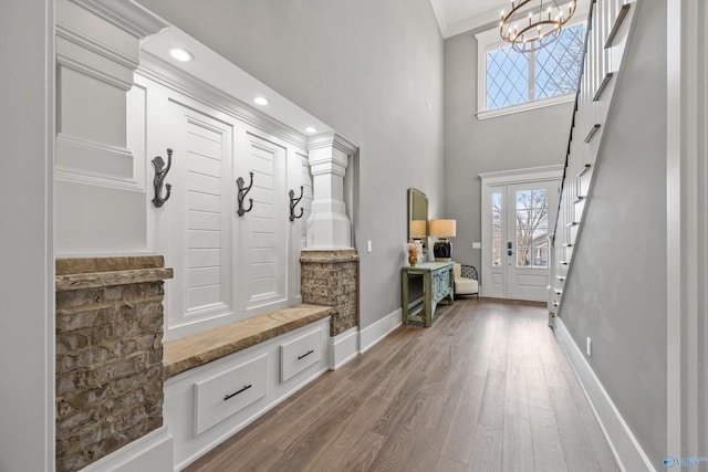2603 Whitesburg Dr, Huntsville, AL 35801 - mudroom with plenty of natural light, a high ceiling, an inviting chandelier, wood finished floors, and ornamental molding