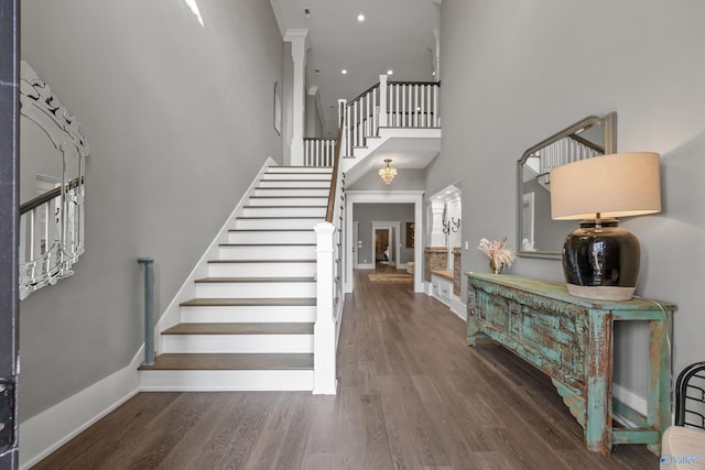 2603 Whitesburg Dr, Huntsville, AL 35801 - entrance foyer featuring baseboards, a towering ceiling, recessed lighting, wood finished floors, and stairway