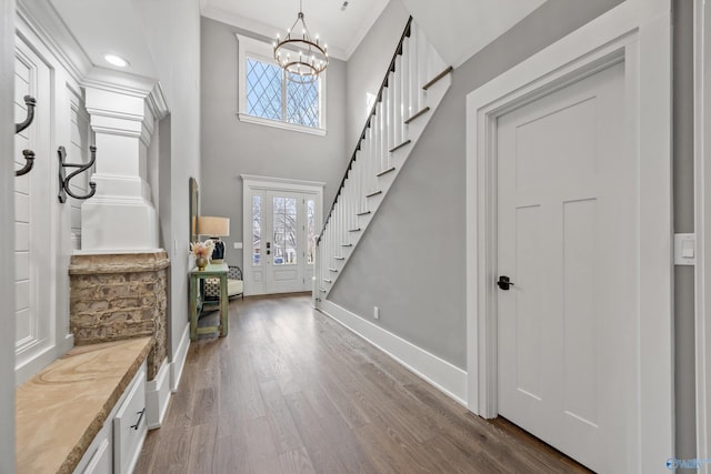 2603 Whitesburg Dr, Huntsville, AL 35801 - foyer entrance with baseboards, an inviting chandelier, stairs, crown molding, and dark wood-type flooring