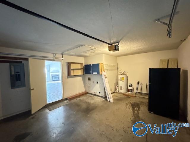 garage with electric panel, water heater, and a garage door opener