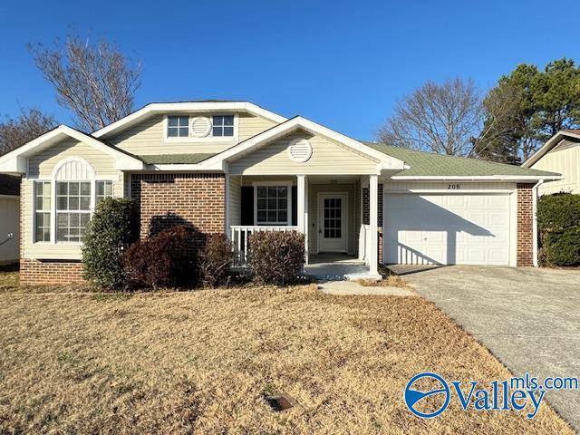 view of front of property featuring covered porch and a garage