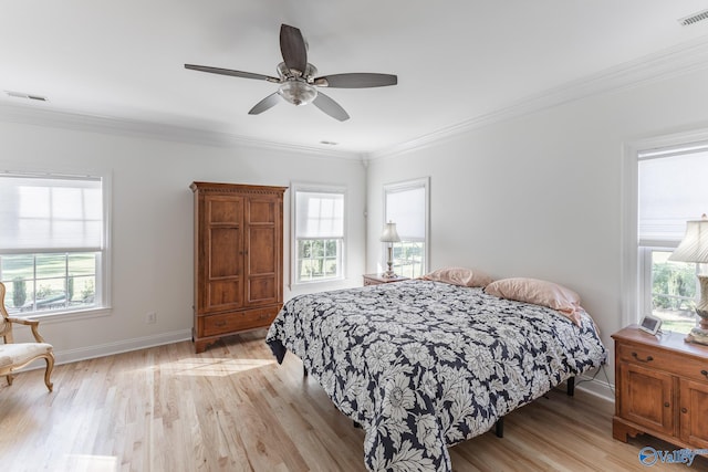 bedroom featuring ornamental molding, ceiling fan, and light hardwood / wood-style flooring