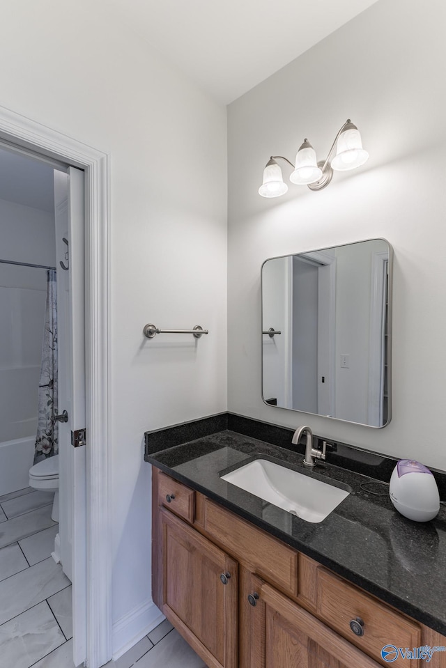 bathroom with vanity and toilet