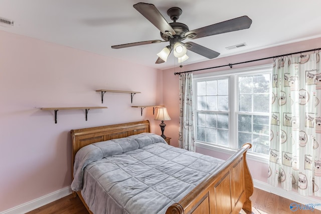 bedroom featuring ceiling fan and hardwood / wood-style flooring