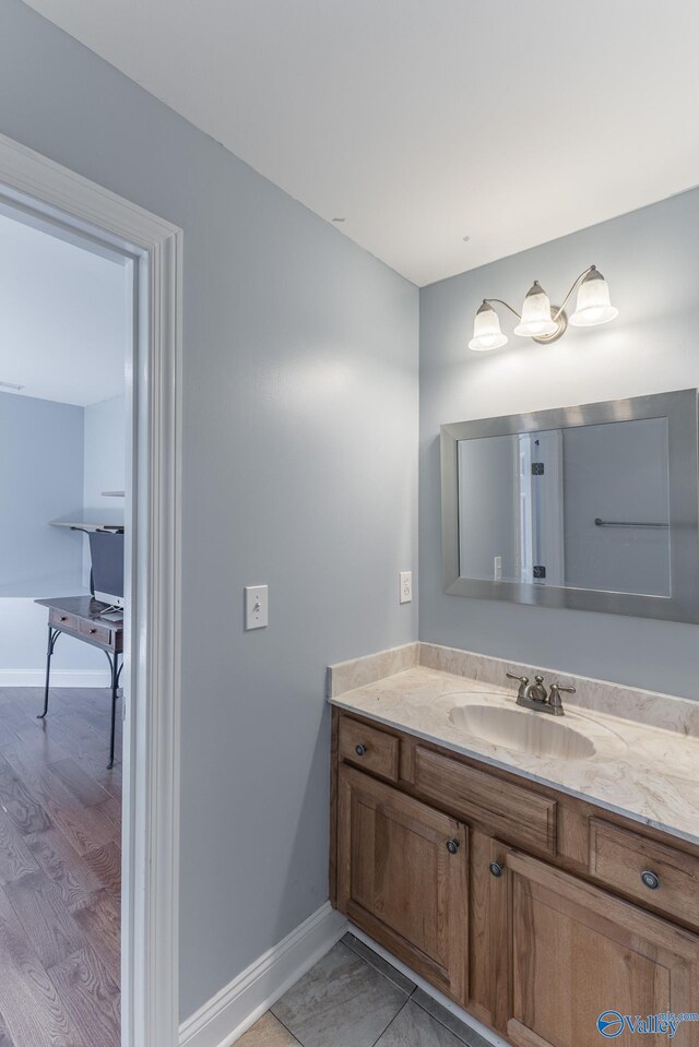 bathroom featuring wood-type flooring and vanity