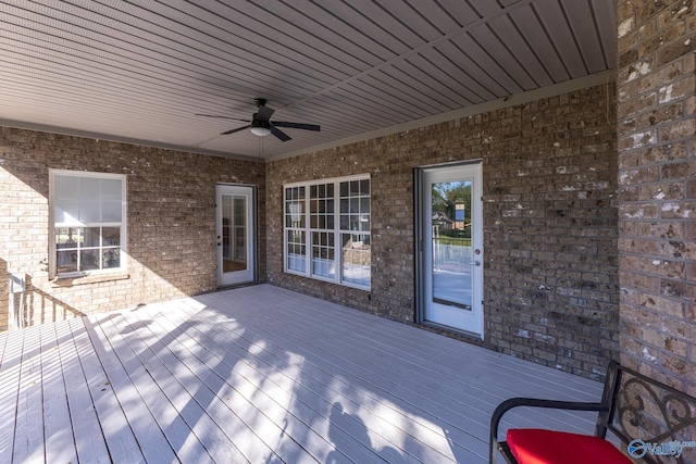 wooden terrace featuring ceiling fan