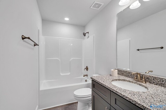 bathroom with visible vents, toilet, vanity, and bathtub / shower combination