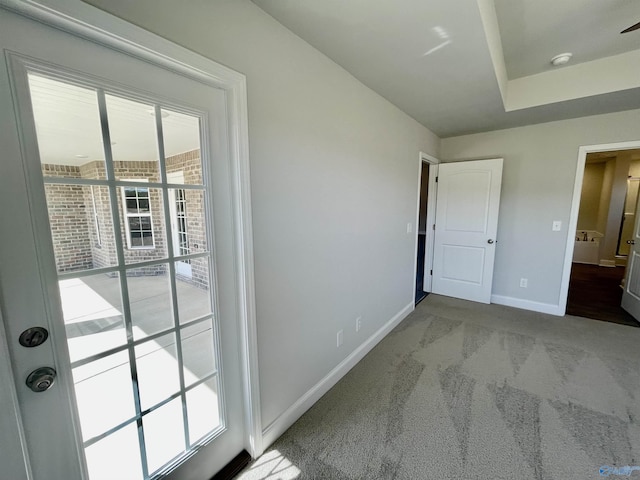 unfurnished bedroom featuring carpet flooring and baseboards