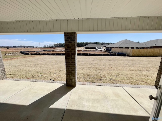 view of yard with a patio and fence