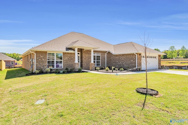 ranch-style home featuring a garage and a front yard