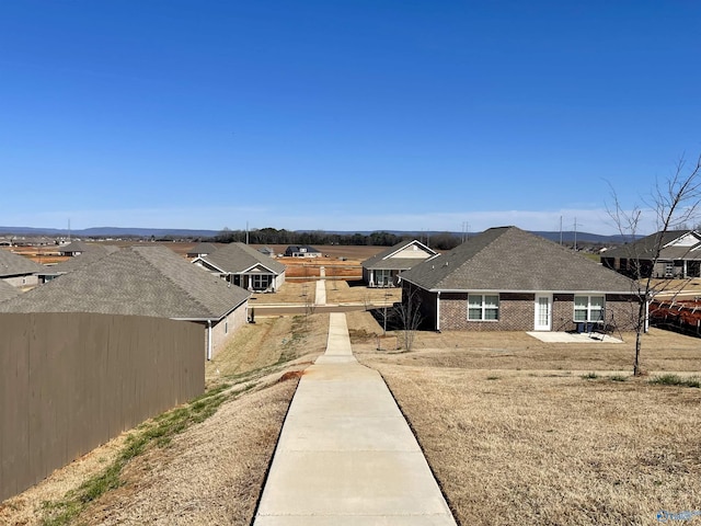 view of yard with fence and a residential view