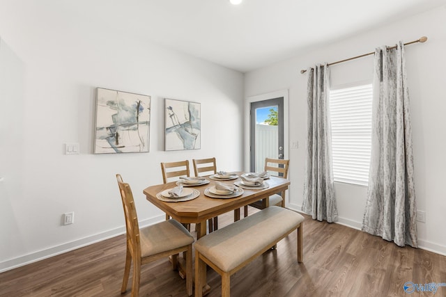 dining space featuring dark hardwood / wood-style floors