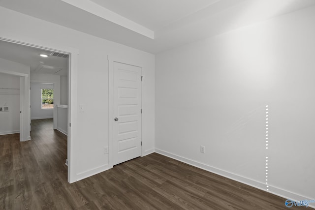 unfurnished bedroom with dark hardwood / wood-style floors