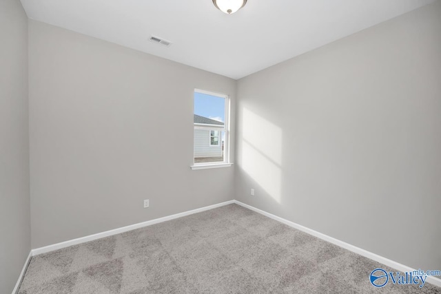 empty room with light colored carpet