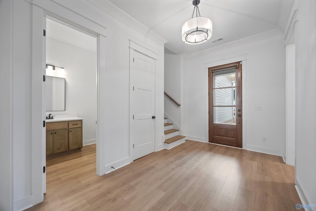 entrance foyer with light hardwood / wood-style floors