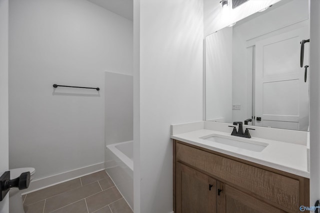 bathroom with tile patterned floors and vanity