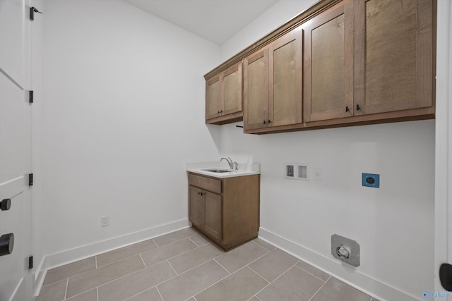 clothes washing area with sink, cabinets, washer hookup, hookup for an electric dryer, and hookup for a gas dryer