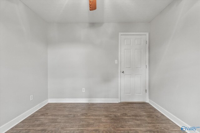 empty room with ceiling fan and hardwood / wood-style flooring