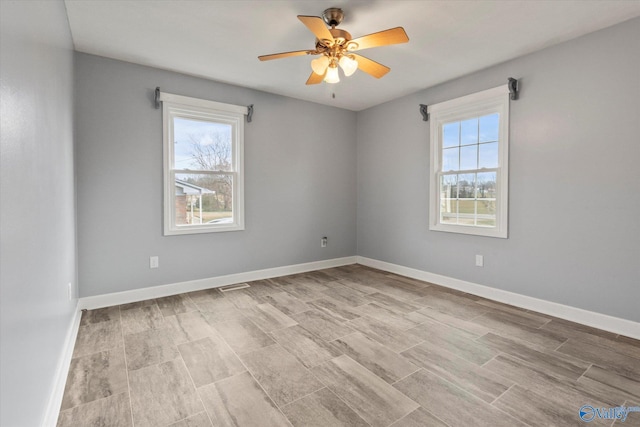 spare room featuring ceiling fan and light wood-type flooring