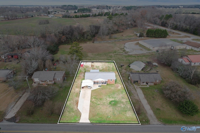 birds eye view of property with a rural view