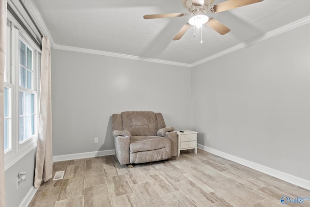 sitting room featuring light wood-type flooring, a wealth of natural light, and ceiling fan