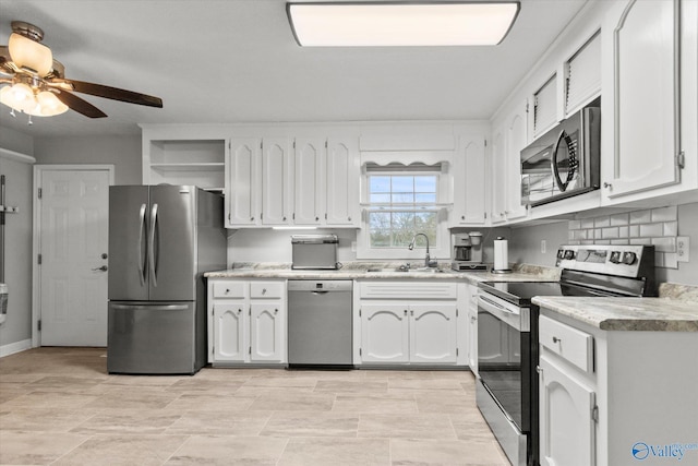 kitchen with ceiling fan, white cabinetry, sink, and appliances with stainless steel finishes