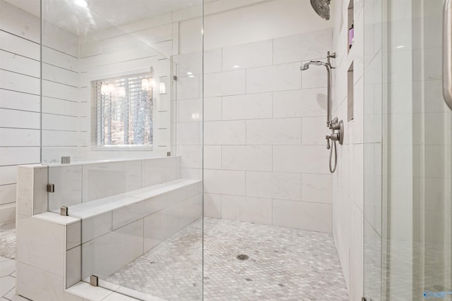 full bath featuring a shower stall