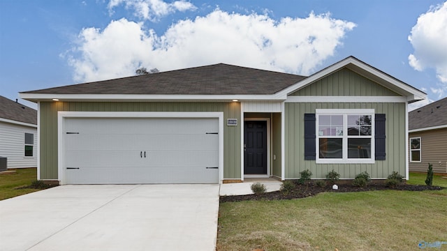 ranch-style house with cooling unit, a garage, and a front lawn