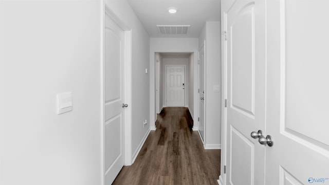 hall with dark hardwood / wood-style flooring