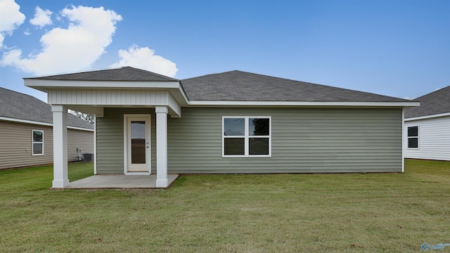 back of property featuring a patio, central AC unit, and a lawn