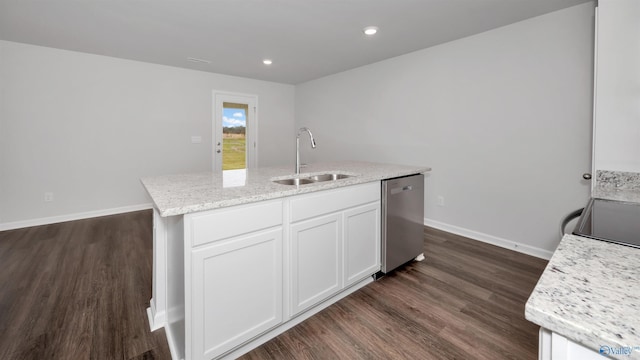 kitchen with sink, light stone counters, white cabinets, a center island with sink, and stainless steel dishwasher