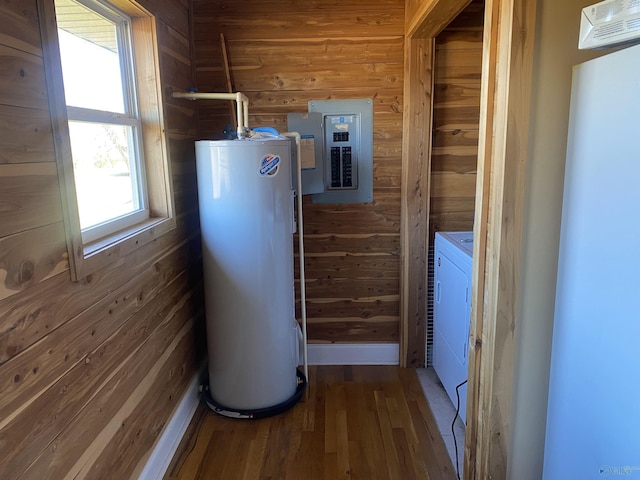 utility room with water heater and electric panel