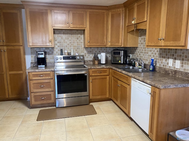 kitchen with light tile patterned floors, backsplash, electric stove, dishwasher, and sink