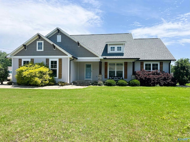 1575 Cottage Ln, Southside, AL 35907 - craftsman house featuring board and batten siding, a front yard, a shingled roof, and covered porch