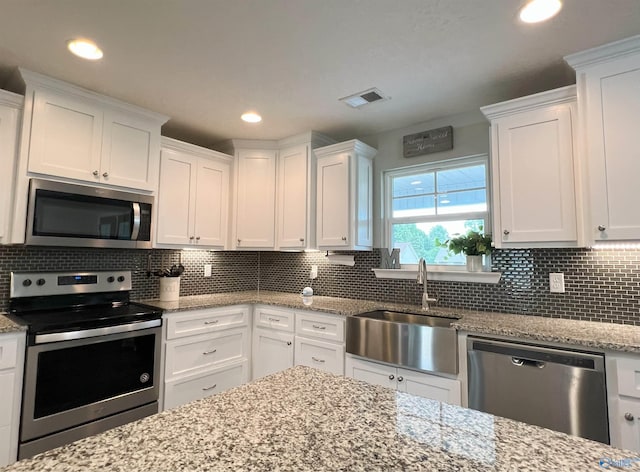 1575 Cottage Ln, Southside, AL 35907 - kitchen with appliances with stainless steel finishes, white cabinets, a sink, and recessed lighting
