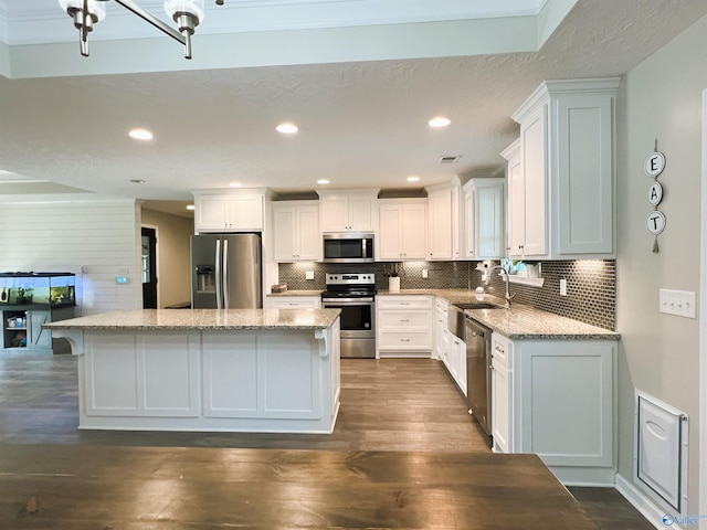 1575 Cottage Ln, Southside, AL 35907 - kitchen with appliances with stainless steel finishes, a sink, a center island, white cabinets, and recessed lighting