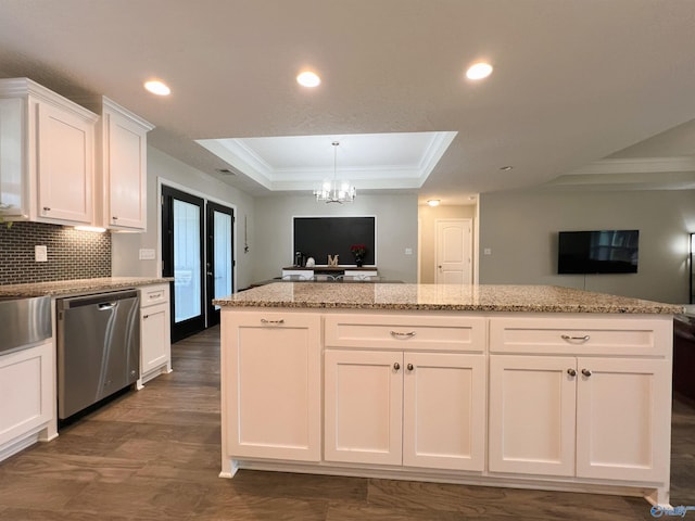 1575 Cottage Ln, Southside, AL 35907 - kitchen with stainless steel dishwasher, open floor plan, ornamental molding, a raised ceiling, and white cabinetry