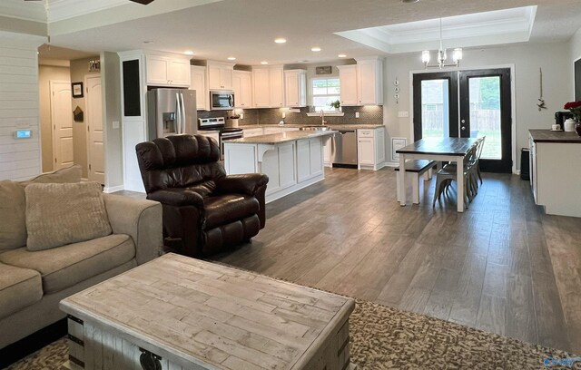 1575 Cottage Ln, Southside, AL 35907 - living area featuring crown molding, dark wood finished floors, a tray ceiling, recessed lighting, and a chandelier