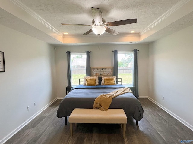 1575 Cottage Ln, Southside, AL 35907 - bedroom with a tray ceiling, multiple windows, dark wood finished floors, a textured ceiling, and crown molding