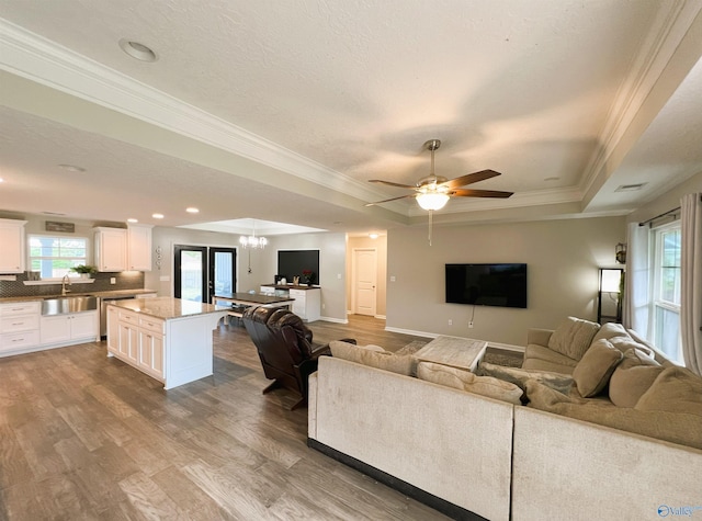 1575 Cottage Ln, Southside, AL 35907 - living area with a raised ceiling, crown molding, wood finished floors, ceiling fan, and recessed lighting