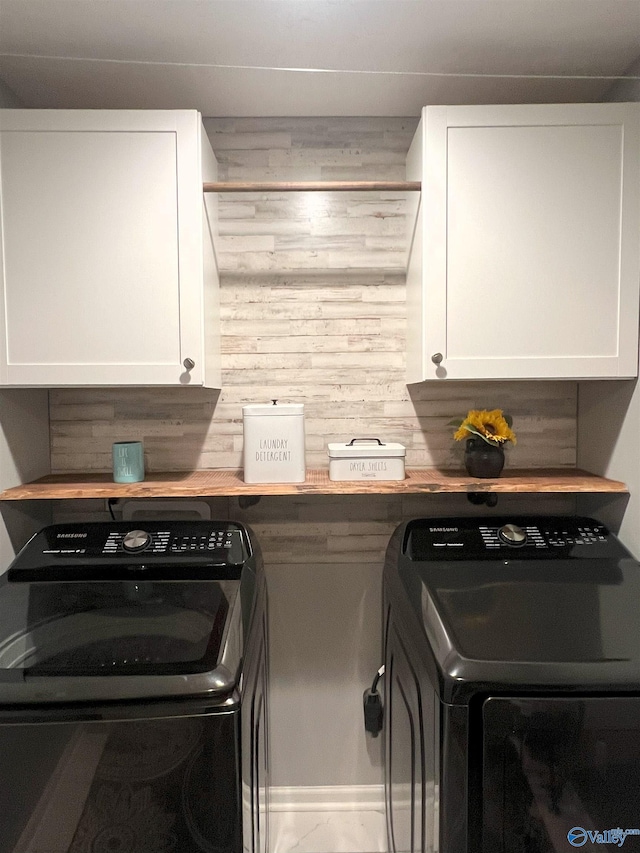 1575 Cottage Ln, Southside, AL 35907 - laundry area with washing machine and dryer, cabinet space, and wood walls