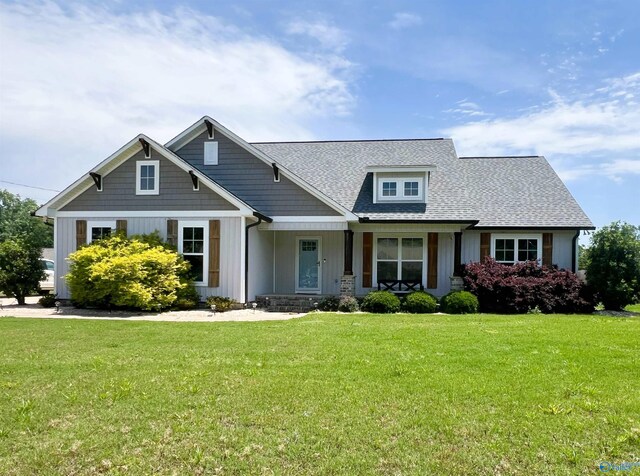 1575 Cottage Ln, Southside, AL 35907 - craftsman house featuring board and batten siding, a front yard, a porch, and roof with shingles