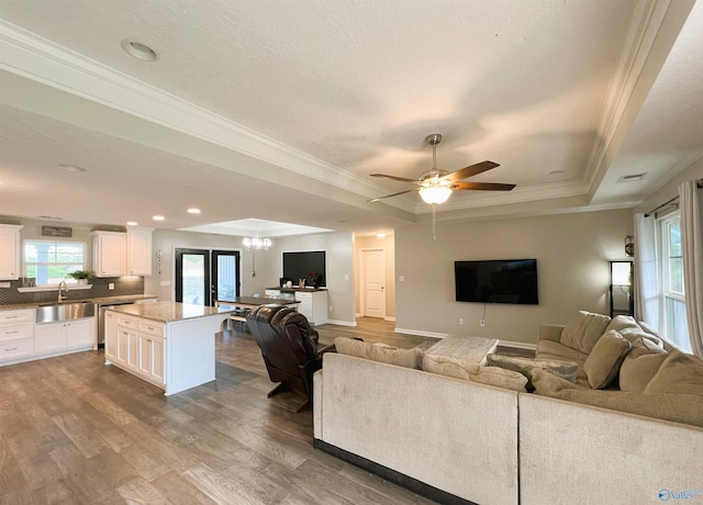 1575 Cottage Ln, Southside, AL 35907 - living area with a raised ceiling, crown molding, wood finished floors, ceiling fan, and recessed lighting