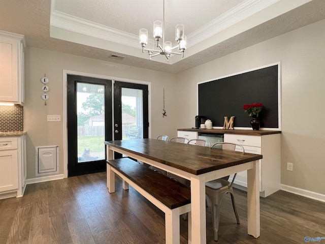 1575 Cottage Ln, Southside, AL 35907 - dining area with a tray ceiling, french doors, dark wood-style flooring, a chandelier, and crown molding