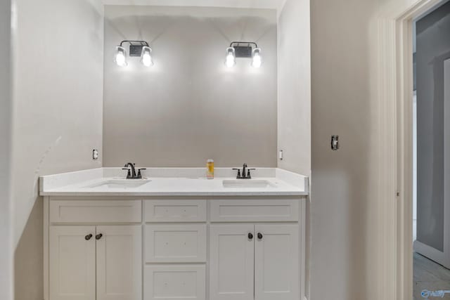 full bath with double vanity and a sink