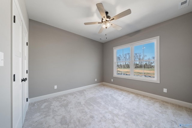 unfurnished bedroom featuring visible vents, ceiling fan, light carpet, and baseboards